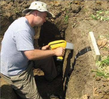 Research team collecting field data for contaminant metal depth migration in Nanjing, China