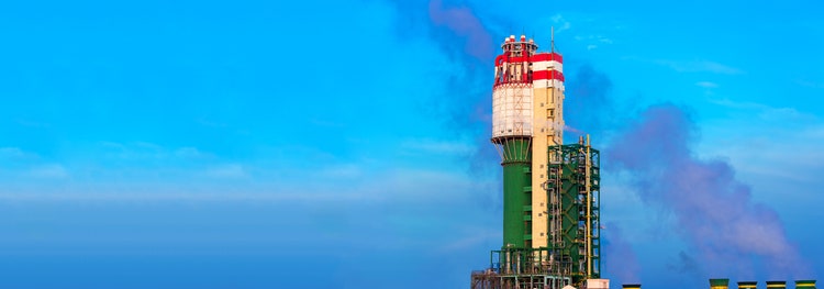 Exhaust tower of a chemical processing plant that produces ammonia-based fertilizer