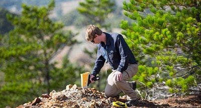 A Vanta XRF analyzer being used in the field to map rock types and alteration.