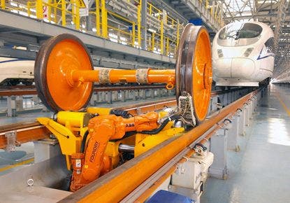 Dismounted wheelset of a train on a DTEC GmbH automated ultrasonic inspection system