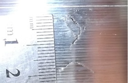 Fatigue cracks in train wheels before and after the tread is reprofiled