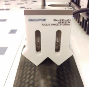 Concave curved immersion phased array probe in a holder covering radii from 3 to 20 mm