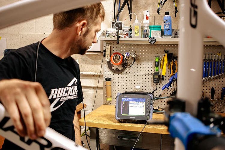 Shawn Small of Ruckus Composites inspecting a composite bike frame using the OmniScan SX