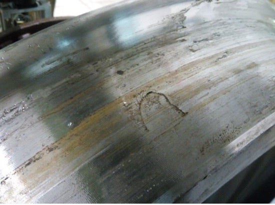 Fatigue cracks in train wheels before and after the tread is reprofiled