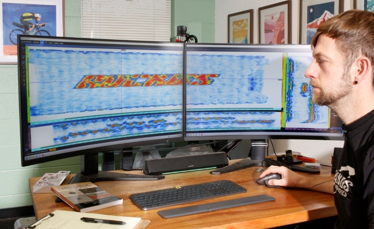 A person working on a computer Description automatically generated