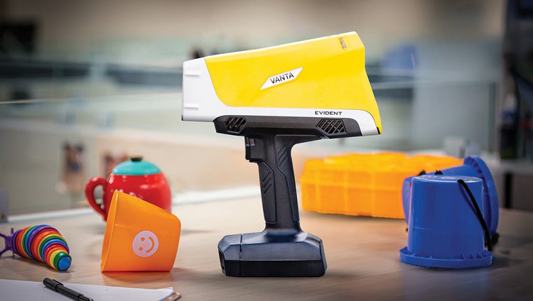 A yellow and white device on a table Description automatically generated