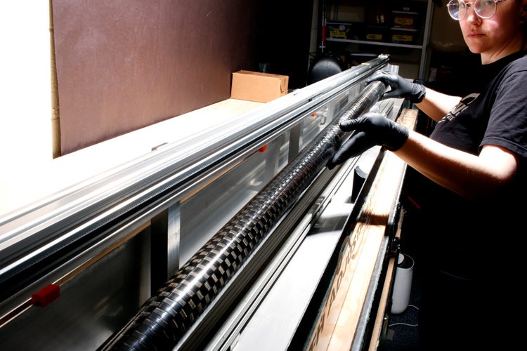 A person working on a machine Description automatically generated