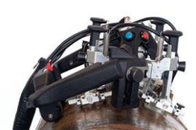 AxSEAM long seam UT weld inspection scanner performing a girth weld scan on a steel pipe