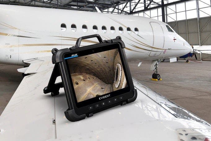 A tablet on a white plane AI-generated content may be incorrect.