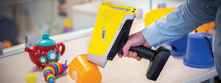 A person holding a scanner Description automatically generated